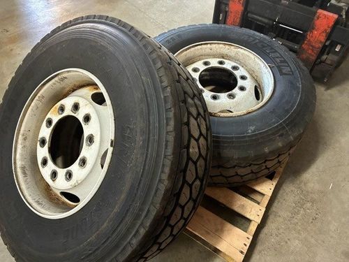 1 Michelin 385 / 65 R22.5 Tire On Steel Rim & 1 Bridgestone 385 / 65 R22.5 Tpoorire On Steel Rim