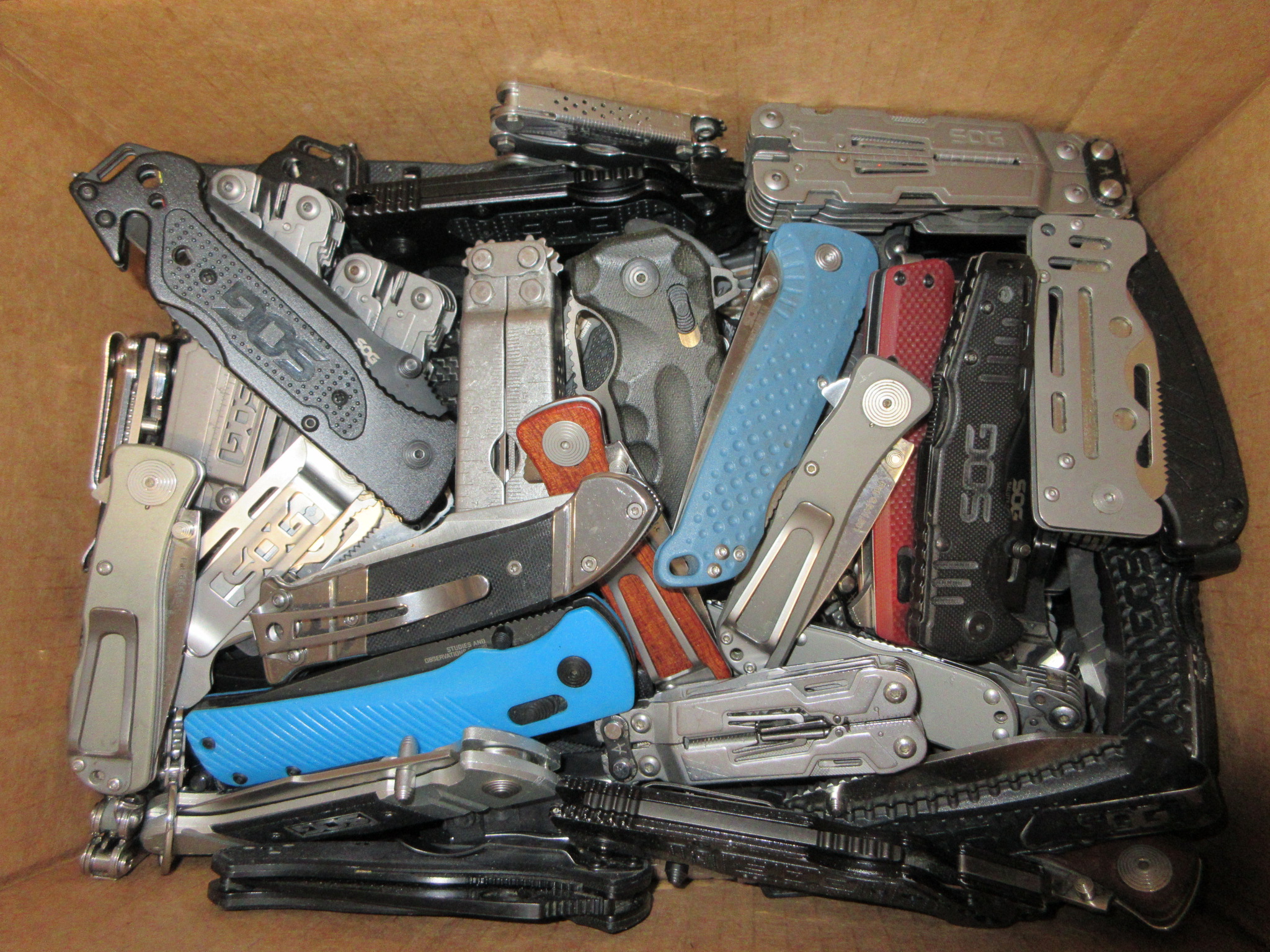 25 POUND BOX OF SOG KNIVES