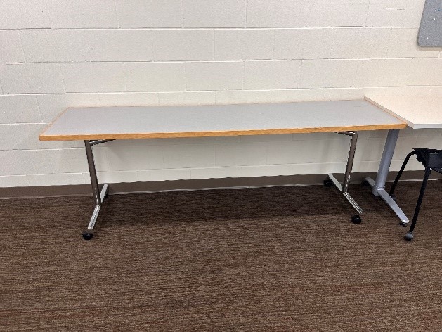11 - T-LEG TABLE WITH WHEELS: 84” X 21” X 24” H